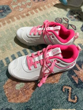 Under Armour White and Hot Pink Kids' softball cleats